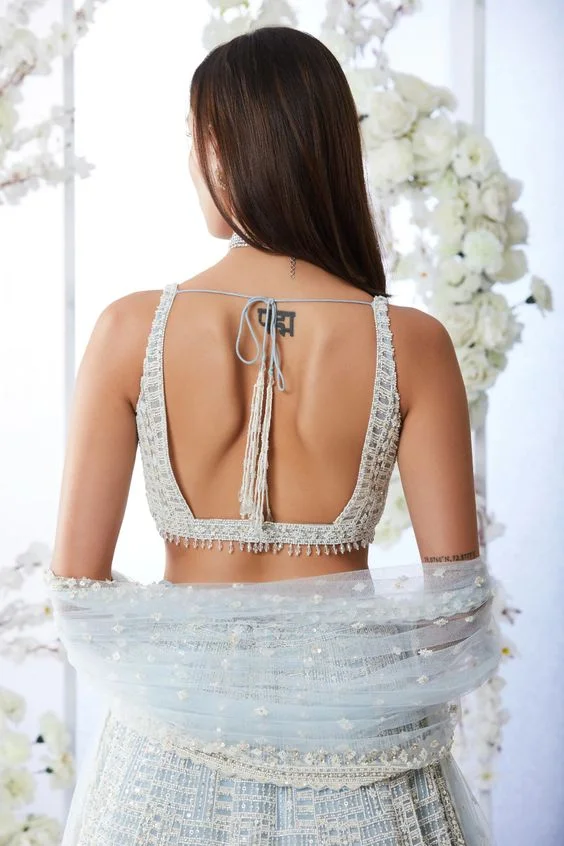 Backless blouse with heavy beadwork